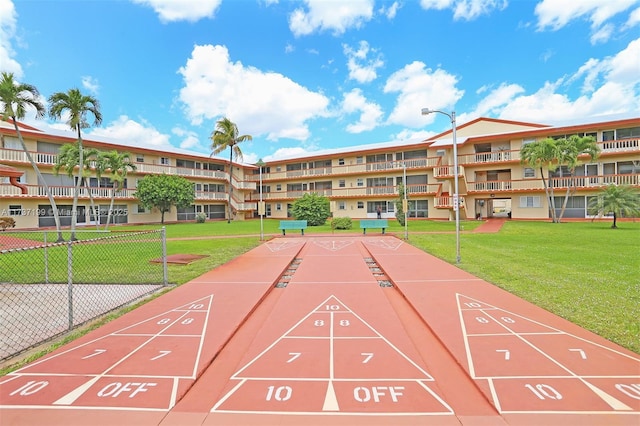 view of community featuring a yard