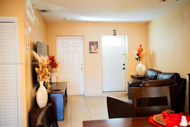 entryway featuring light tile patterned floors