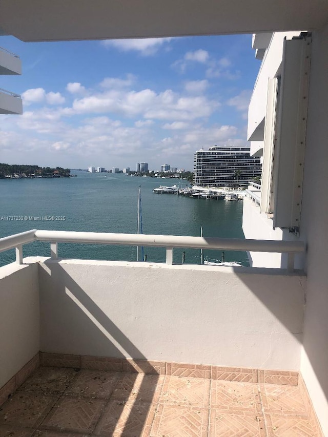 balcony featuring a water view