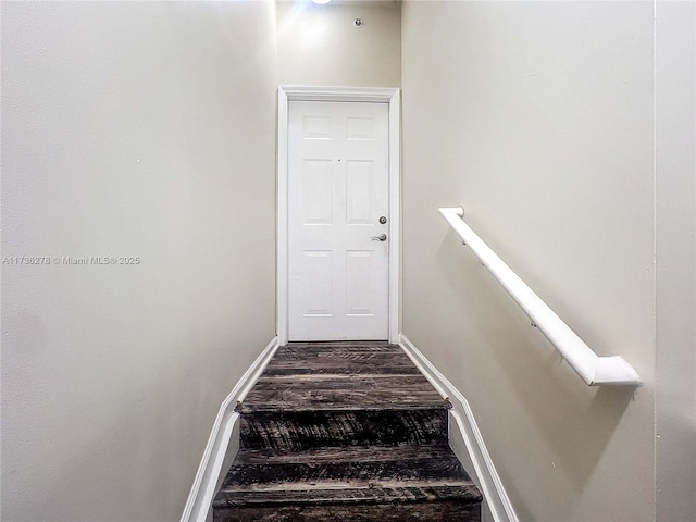 stairs with hardwood / wood-style flooring