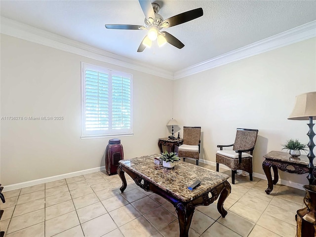 sitting room with crown molding, ceiling fan, a textured ceiling, and light tile patterned floors