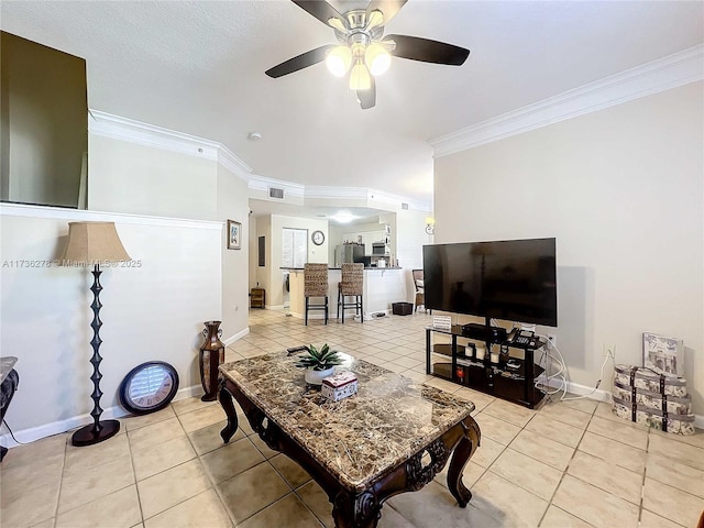 living room with ceiling fan, ornamental molding, and light tile patterned floors