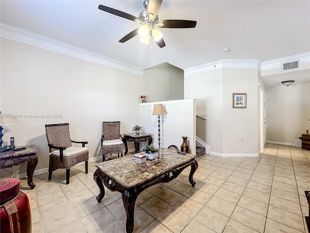 sitting room with ceiling fan, ornamental molding, and light tile patterned floors