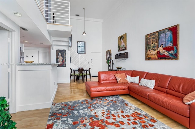 living room with light hardwood / wood-style flooring