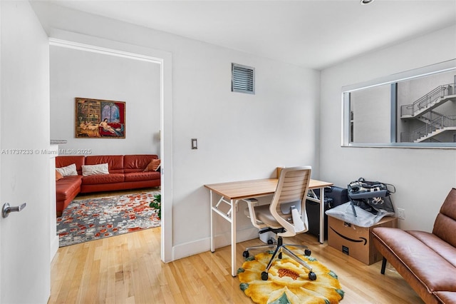 home office featuring hardwood / wood-style flooring