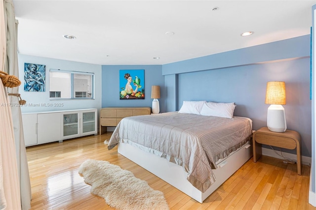 bedroom with light wood-type flooring