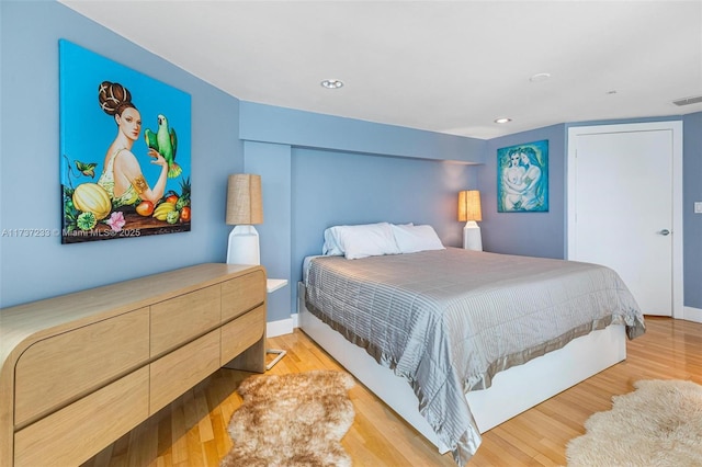 bedroom featuring light hardwood / wood-style floors