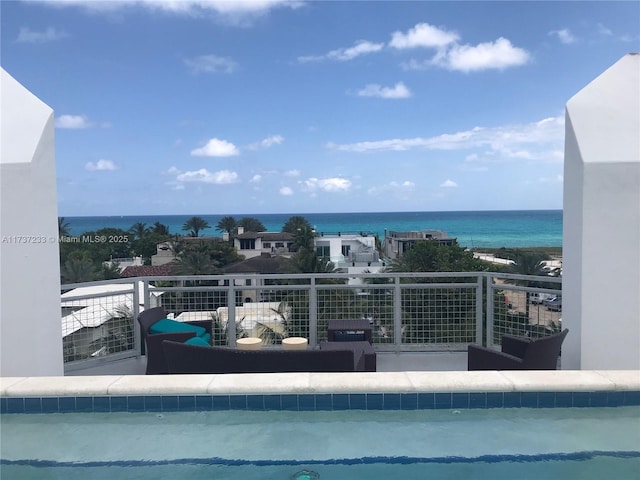 balcony featuring a water view