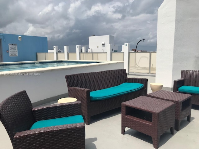 view of patio / terrace featuring a community pool