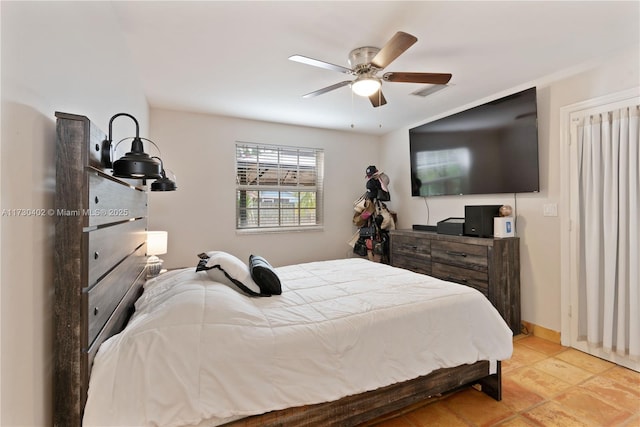 bedroom featuring ceiling fan and light tile patterned floors