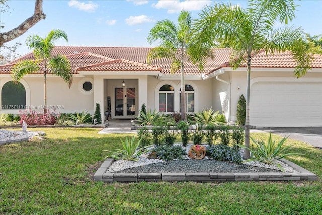 back of property with a garage and a yard