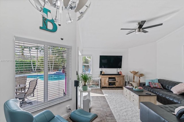 living room with tile patterned floors and ceiling fan