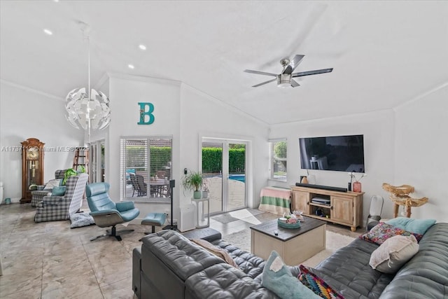 living room with ornamental molding, lofted ceiling, and ceiling fan with notable chandelier