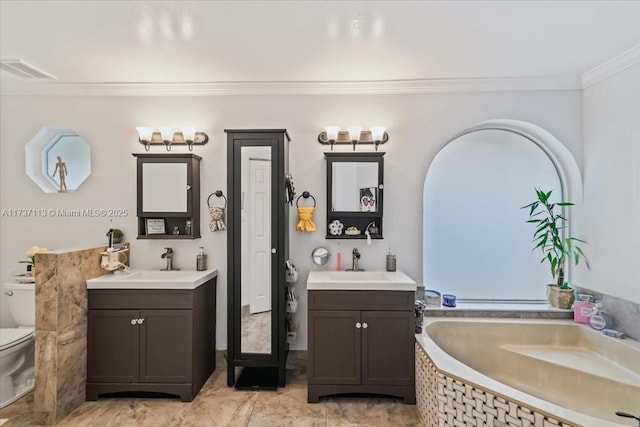 bathroom featuring crown molding, a tub to relax in, vanity, and toilet