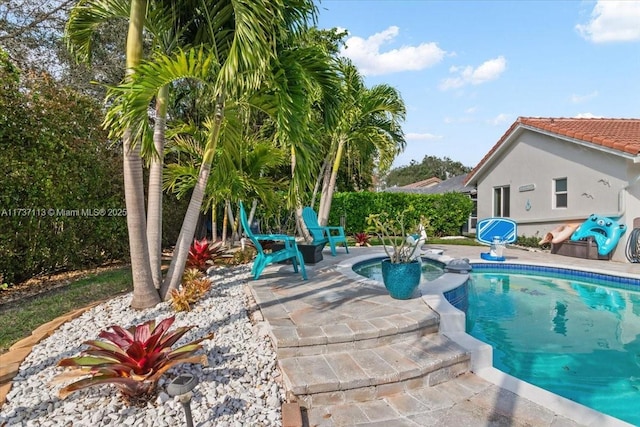 view of pool featuring a patio