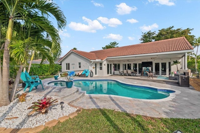 view of pool with a patio area, a hot tub, and ceiling fan