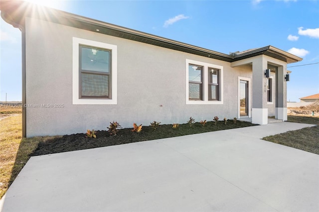 view of front of house featuring stucco siding