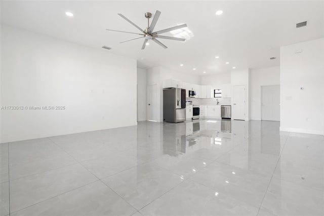 unfurnished living room featuring baseboards, recessed lighting, visible vents, and a ceiling fan