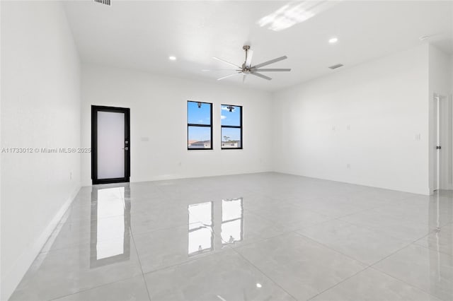 spare room with ceiling fan, visible vents, baseboards, and recessed lighting