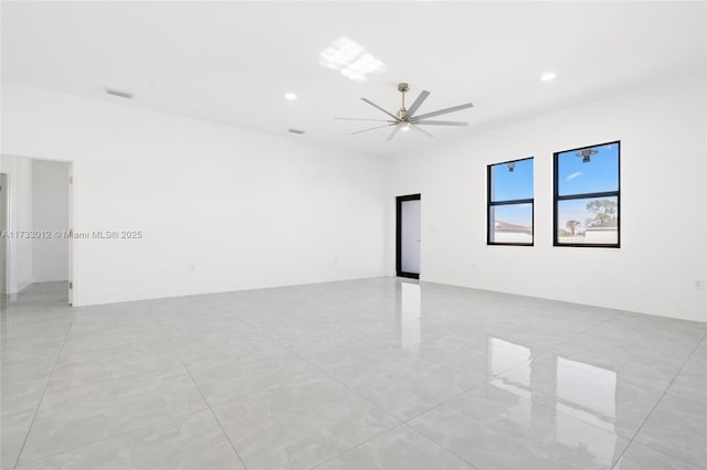 empty room featuring recessed lighting, visible vents, and ceiling fan