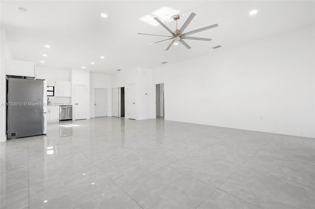 unfurnished living room featuring ceiling fan, visible vents, and recessed lighting