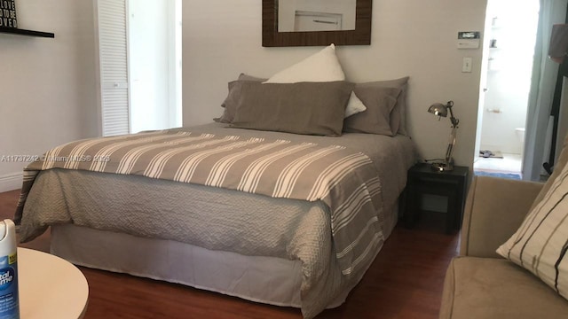 bedroom featuring dark hardwood / wood-style flooring