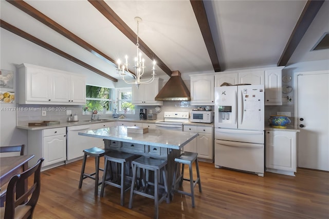 kitchen featuring white cabinetry, white appliances, and a center island