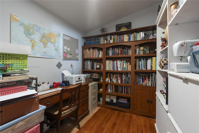 office area featuring vaulted ceiling and wood-type flooring