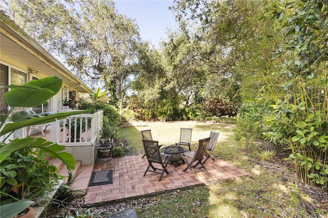 view of patio / terrace with an outdoor fire pit