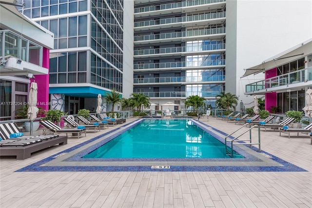 view of swimming pool with a patio