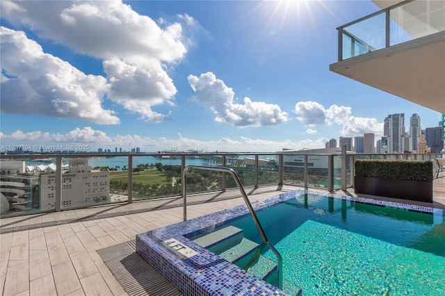 view of pool with a water view