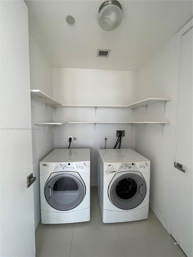 laundry area with washer and dryer