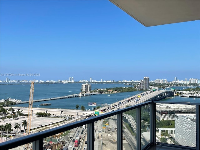 balcony featuring a water view