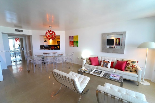 living room with tile patterned floors