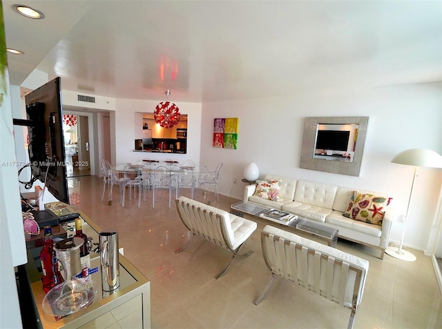 living room with light tile patterned floors