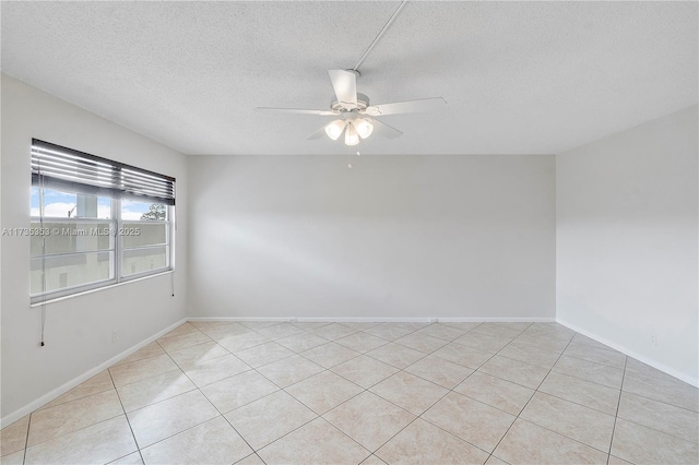 spare room featuring a textured ceiling and ceiling fan