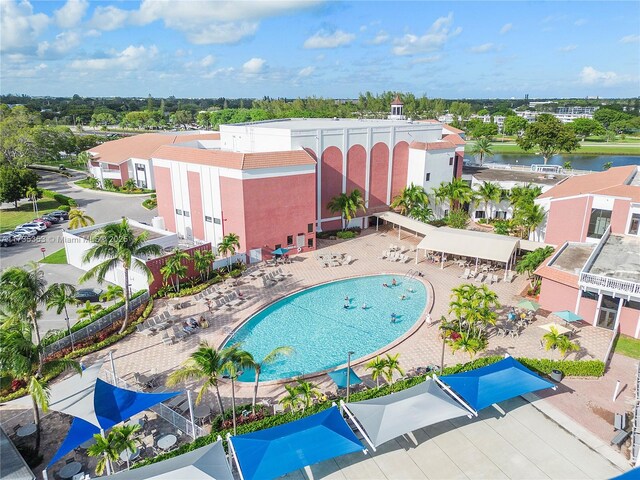 birds eye view of property with a water view