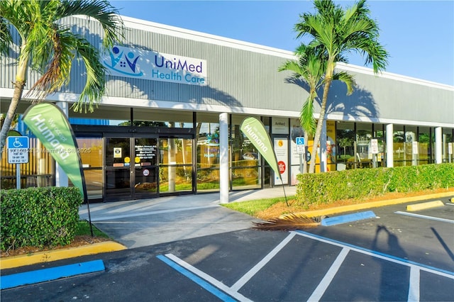 view of property featuring uncovered parking