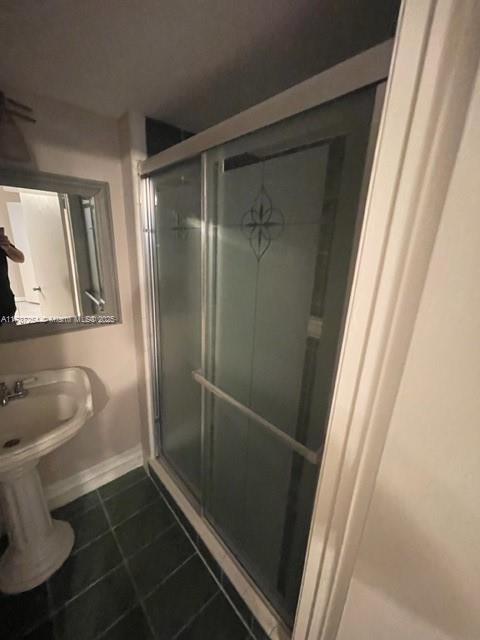 20810 NE 8th Ct Unit 104-18, Miami, FL 33179 - bathroom with tile patterned floors and walk in shower