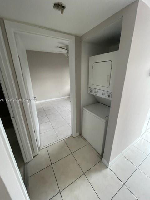 20810 NE 8th Ct Unit 104-18, Miami, FL 33179 - laundry room featuring stacked washer / dryer and light tile patterned floors
