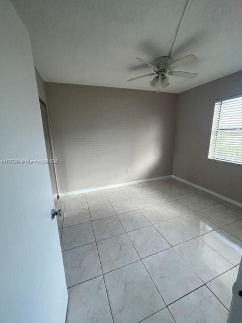 20810 NE 8th Ct Unit 104-18, Miami, FL 33179 - unfurnished room with light tile patterned flooring and ceiling fan