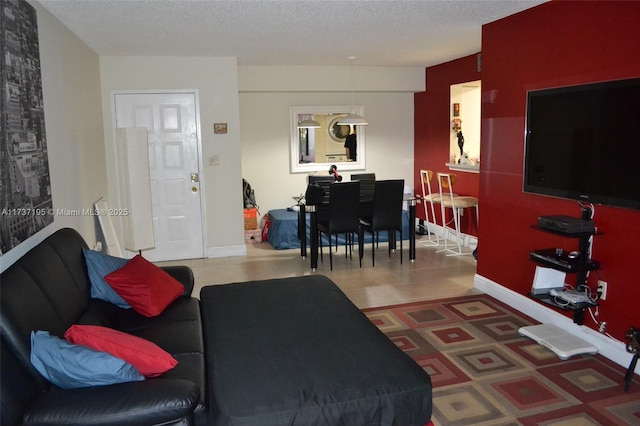 tiled living room with a textured ceiling