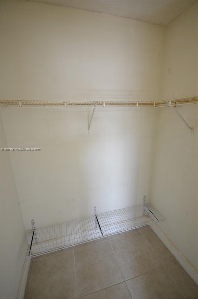 walk in closet featuring tile patterned floors