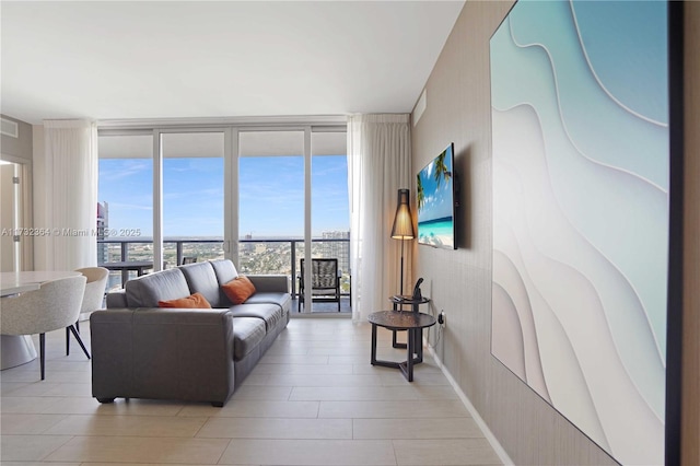 living room featuring a wall of windows