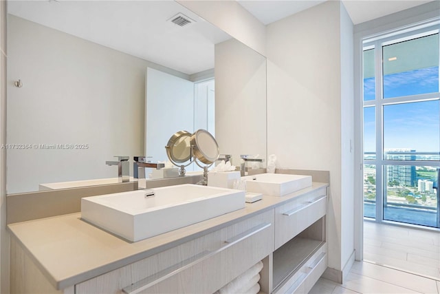 bathroom with vanity and tile patterned flooring