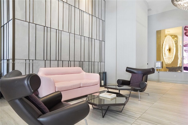 living room featuring a high ceiling