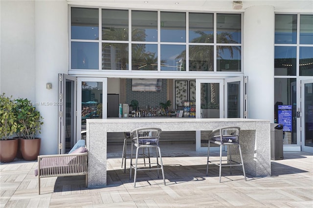 view of patio / terrace featuring an outdoor bar