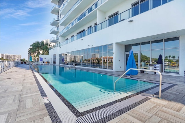 view of swimming pool with a patio