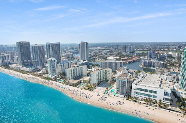 bird's eye view featuring a water view and a view of the beach