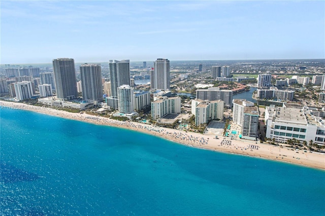 bird's eye view featuring a view of the beach and a water view